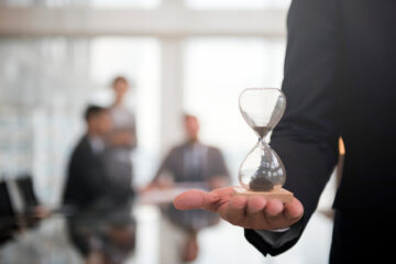 businessman-holding-hour-glass-signifies-importance-being-time